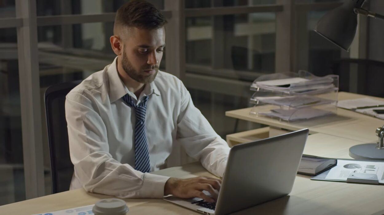 Man Doing Research on Laptop