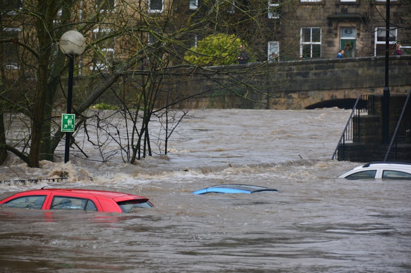 Flooded street with vehicles during heavy rainfall