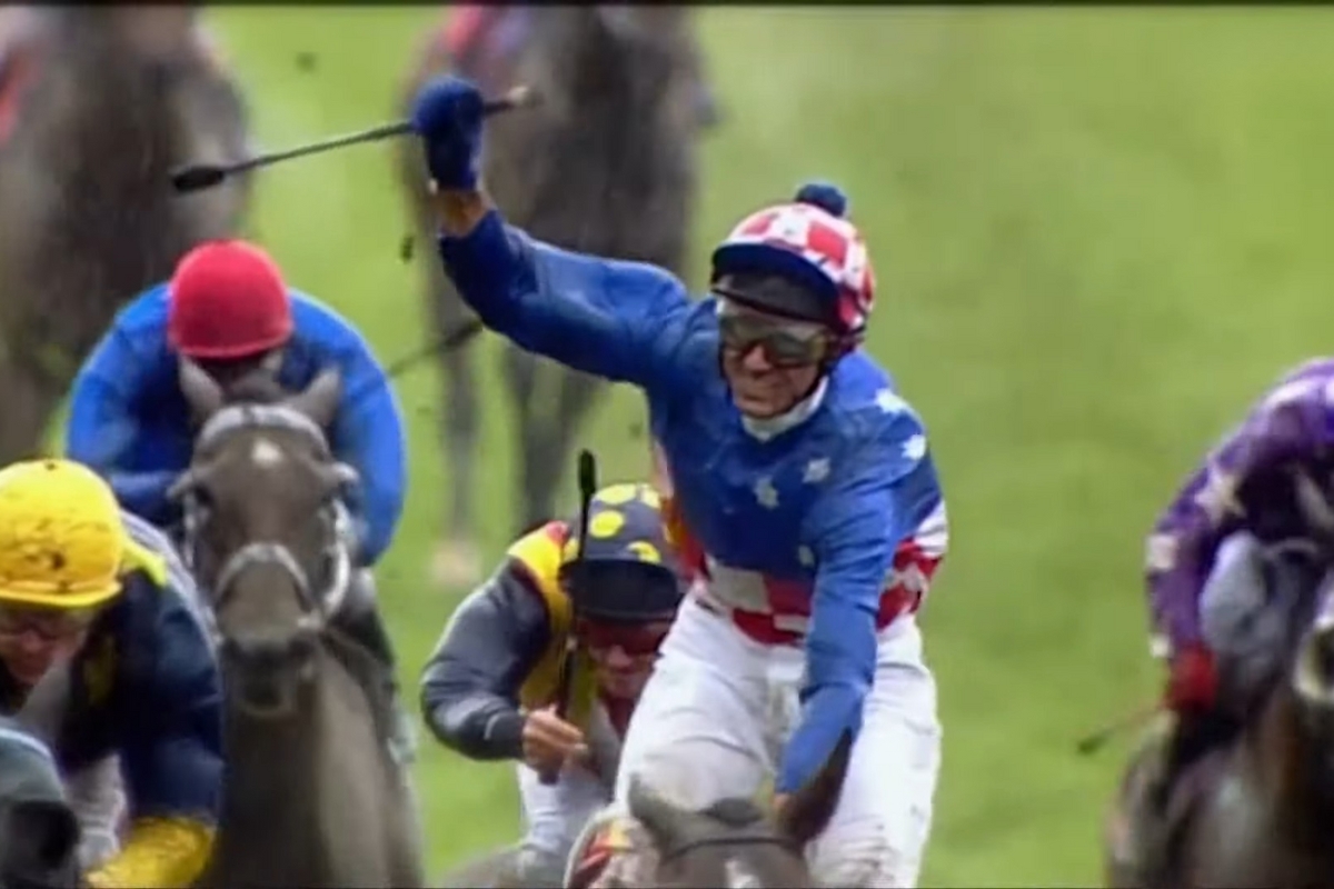 Jockey Glen Boss celebrates victory on Makybe Diva during her historic Melbourne Cup hat-trick run