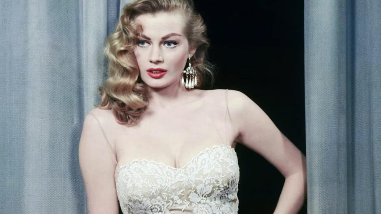 Blonde woman wearing a white lace dress and statement earrings