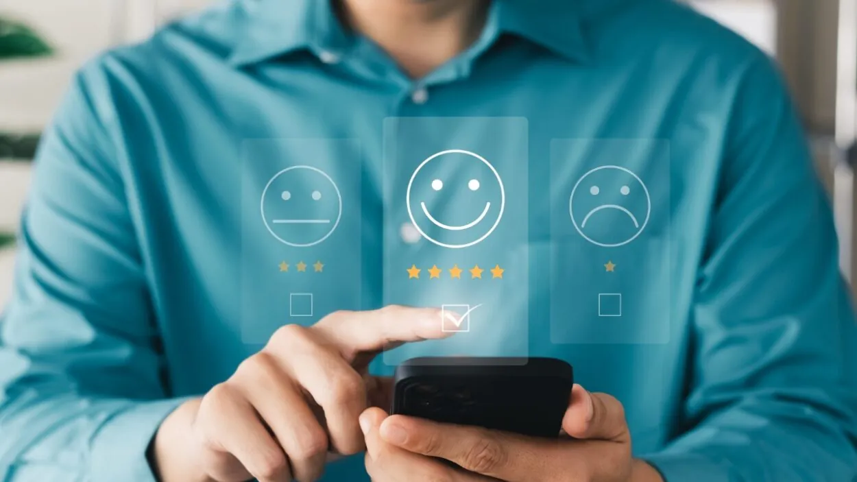 A customer gives a five-star satisfaction rating on a smartphone.