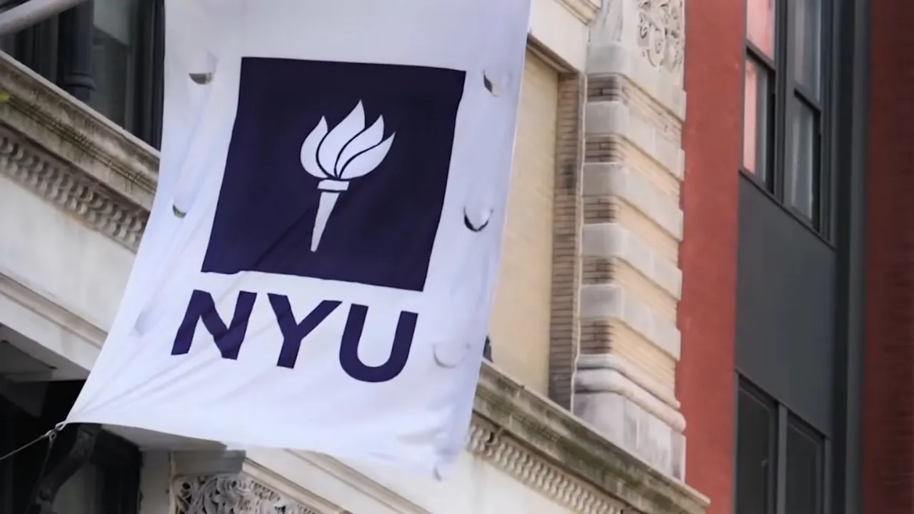 NYU flag displayed outside a university building in New York City