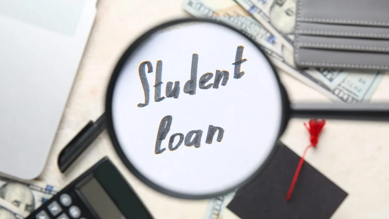 Student loan costs shown with cash, a calculator, and a graduation cap